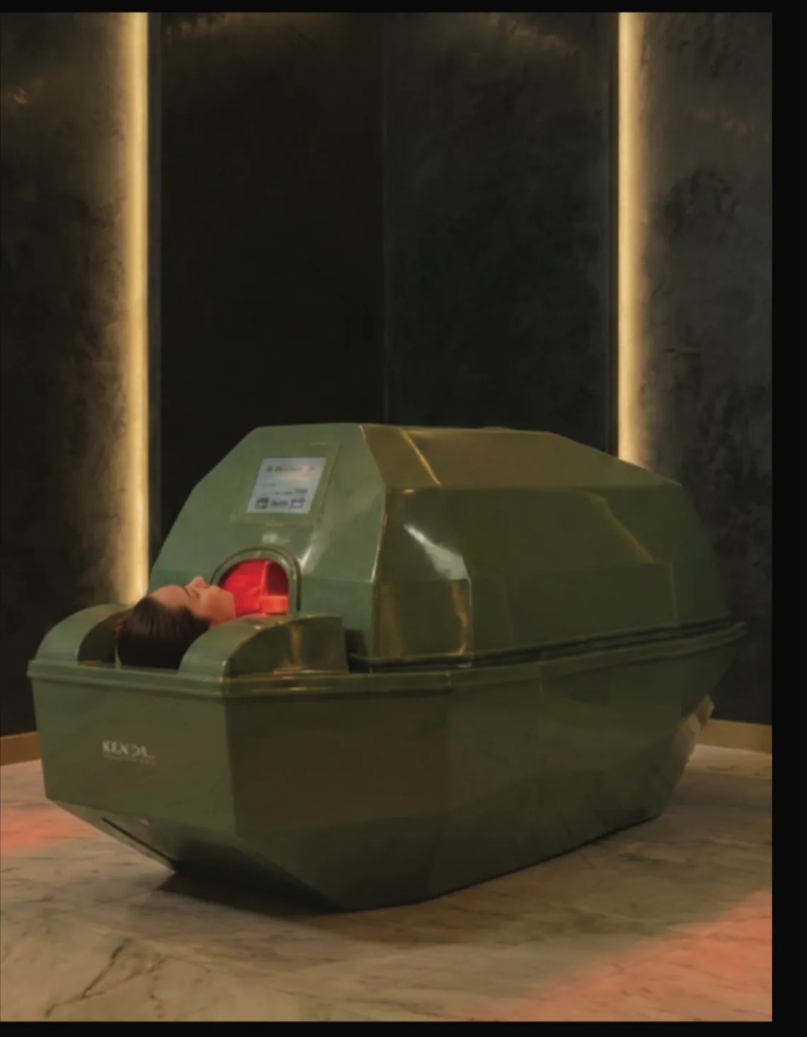 Client lying inside the Space Therapy Plus capsule during treatment